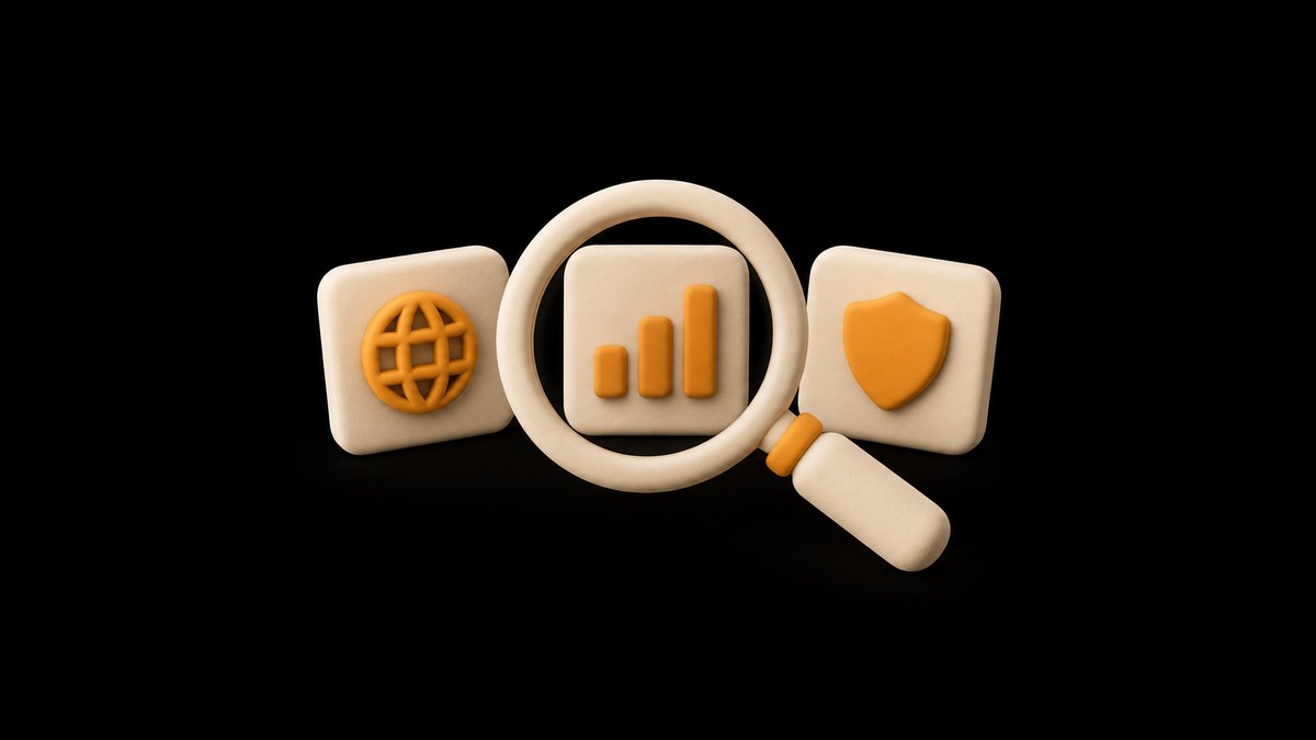 A cream clay magnifying glass over three clay cards marked with an amber globe, an amber bar chart and an amber shield, on a black background.